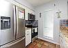 Updated, fully equipped kitchen with new stainless steel appliances and counter tops 