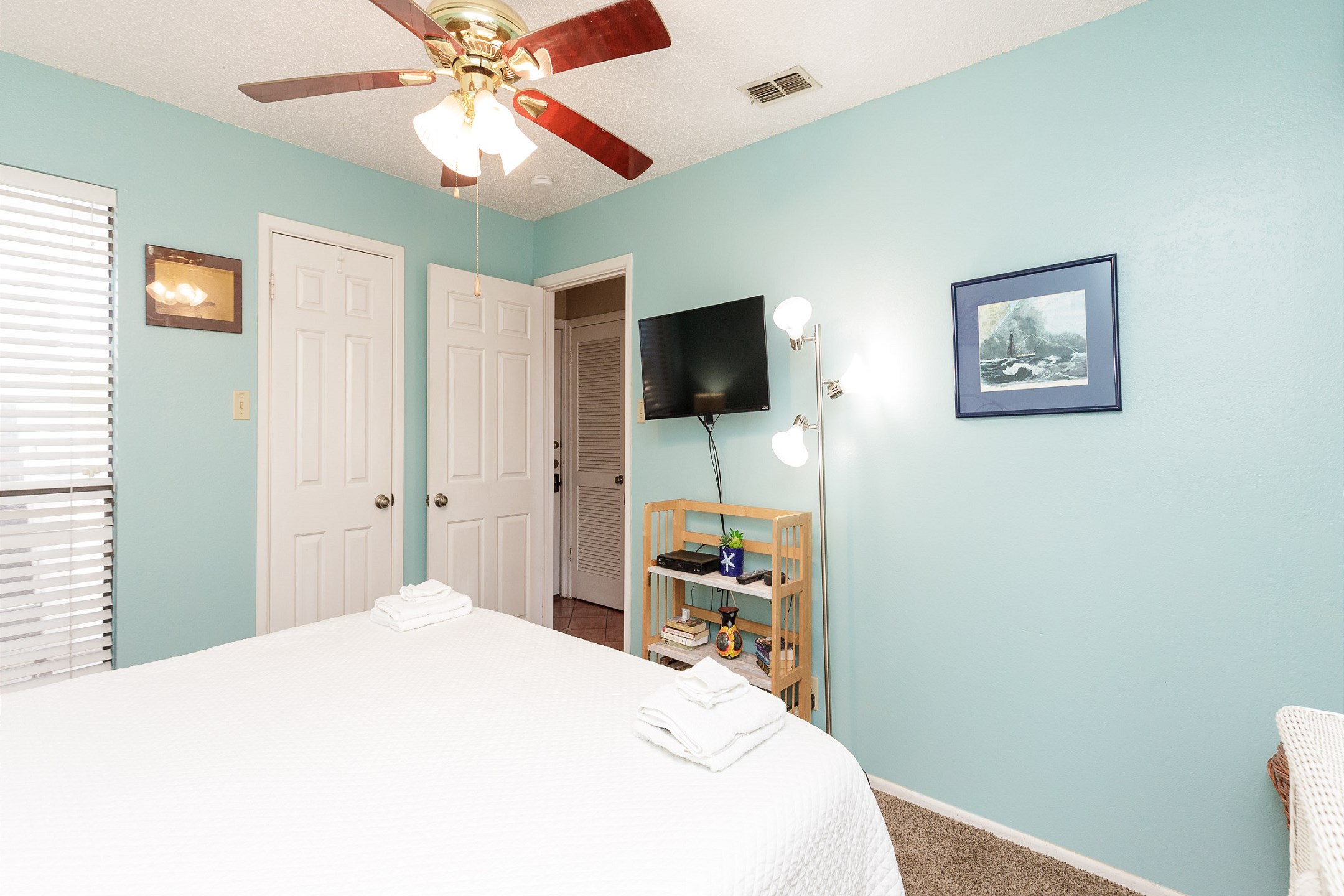 Master bedroom with a king size bed and flat screen TV