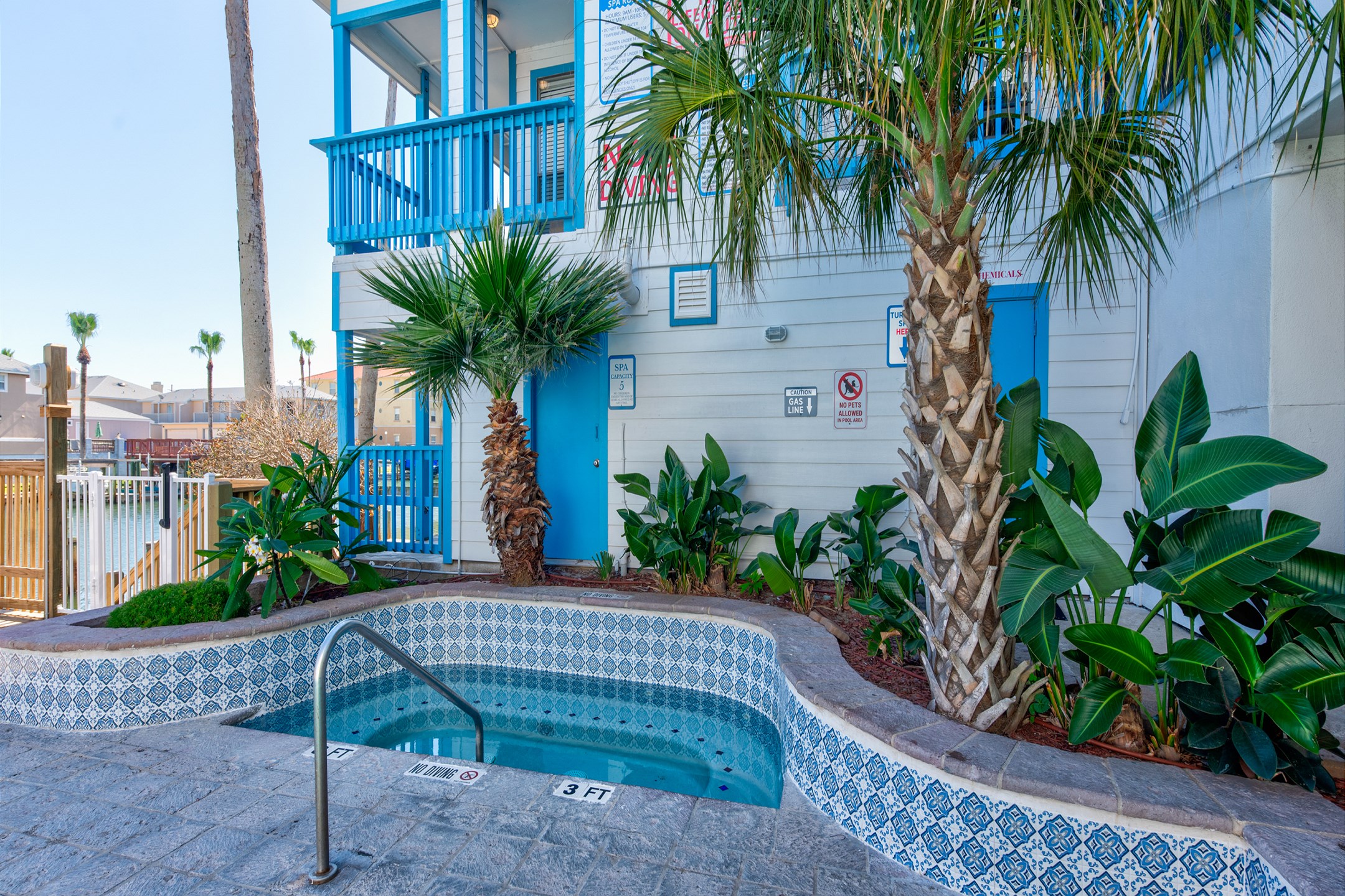 Inviting hot tub to relax in on your vacation, surrounded by enticing greenery