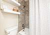 Master bathroom with tub and shower