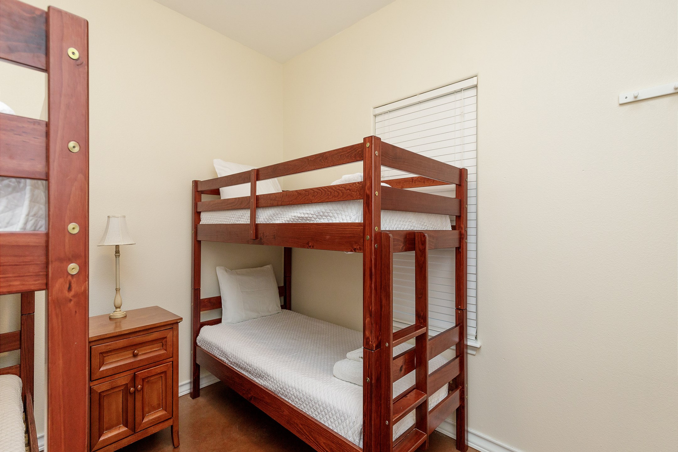 Guest bedroom with two twin size bunk beds, sleeps a total of 4 guests