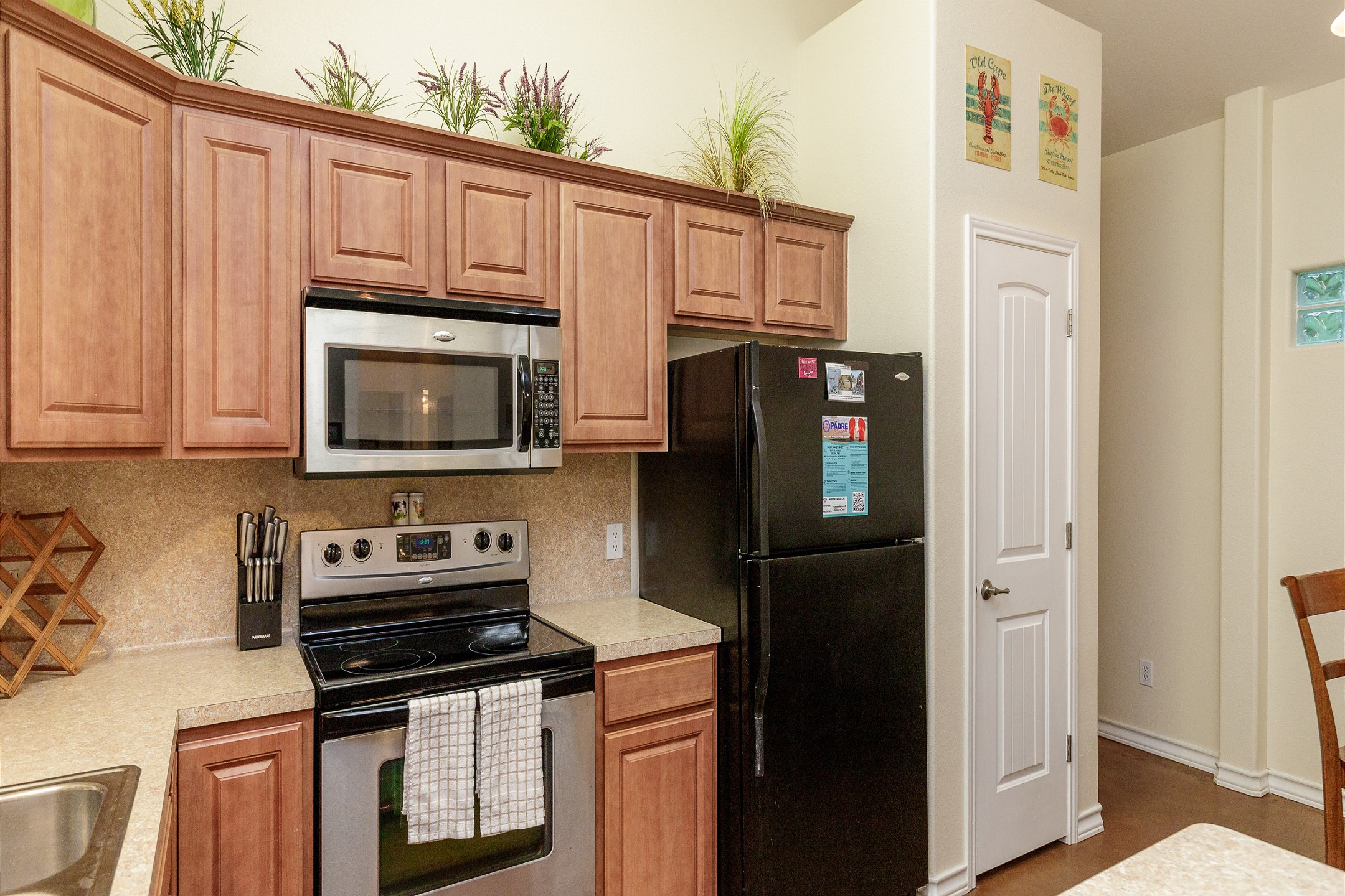 Coffee maker, toaster, cookware, dinnerware, and other kitchen essentials provided