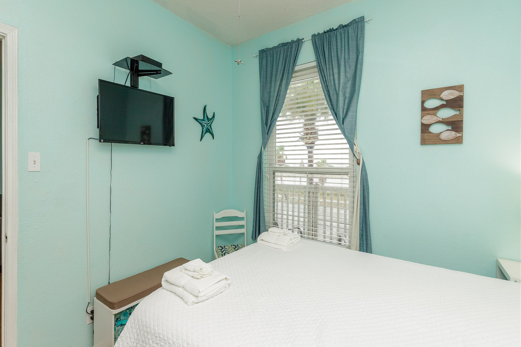 Master bedroom with queen size bed and flat screen TV