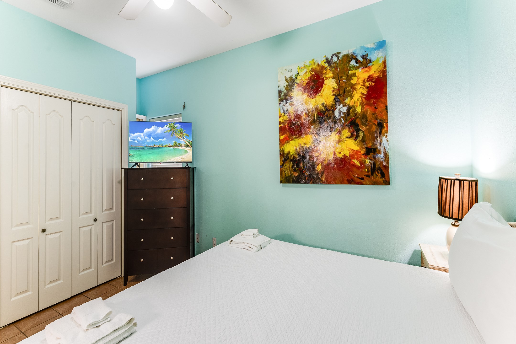 Second bedroom on the first floor with king size bed, private bathroom and flat screen TV