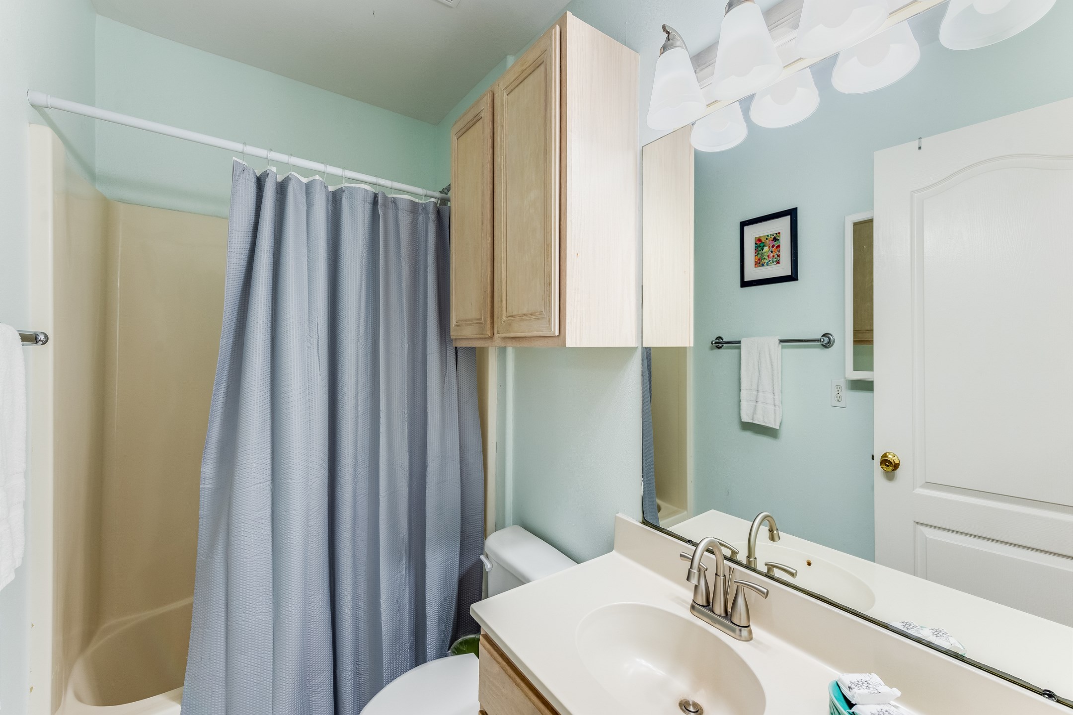 Guest bathroom on the second floor with tub and shower 