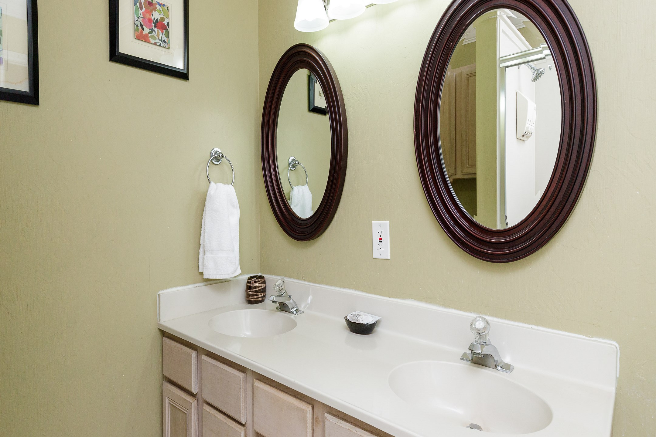 Master bathroom on the second floor with double sinks and tub/shower combo