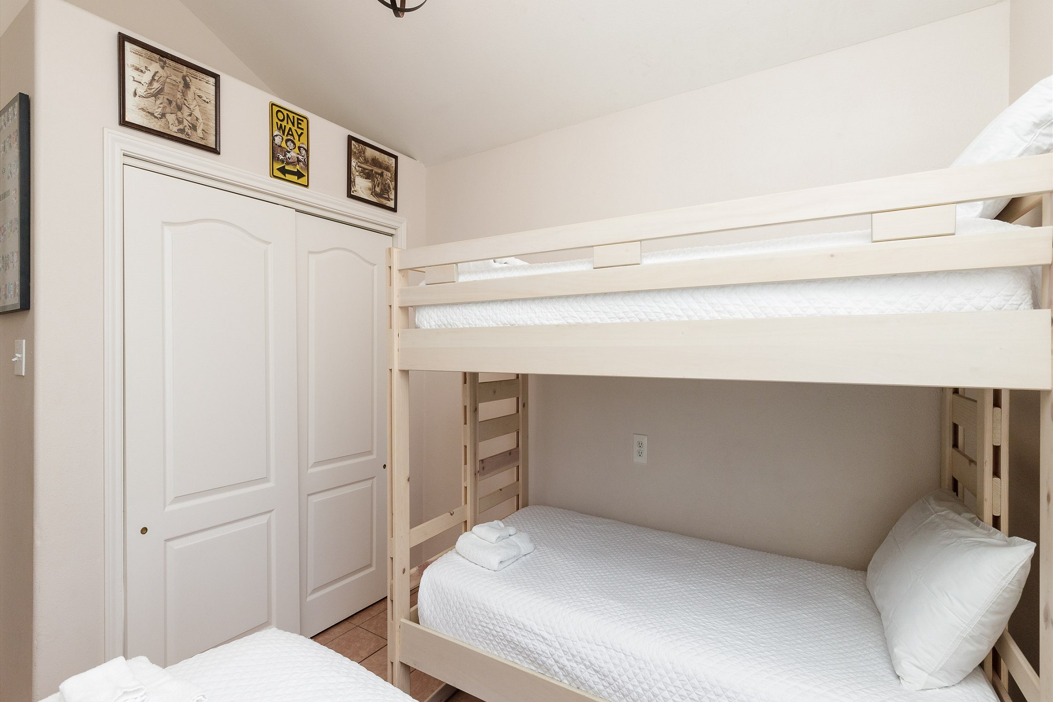 Fourth bedroom on the second floor with twin over twin size bunk beds and twin bed, along with flat screen TV