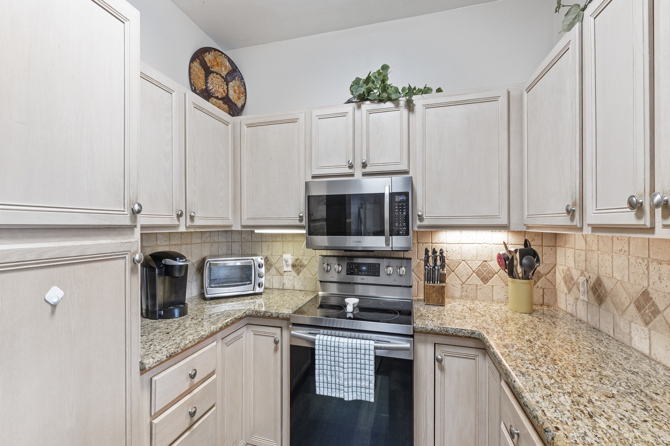 Fully equipped kitchen with stainless steel appliances 