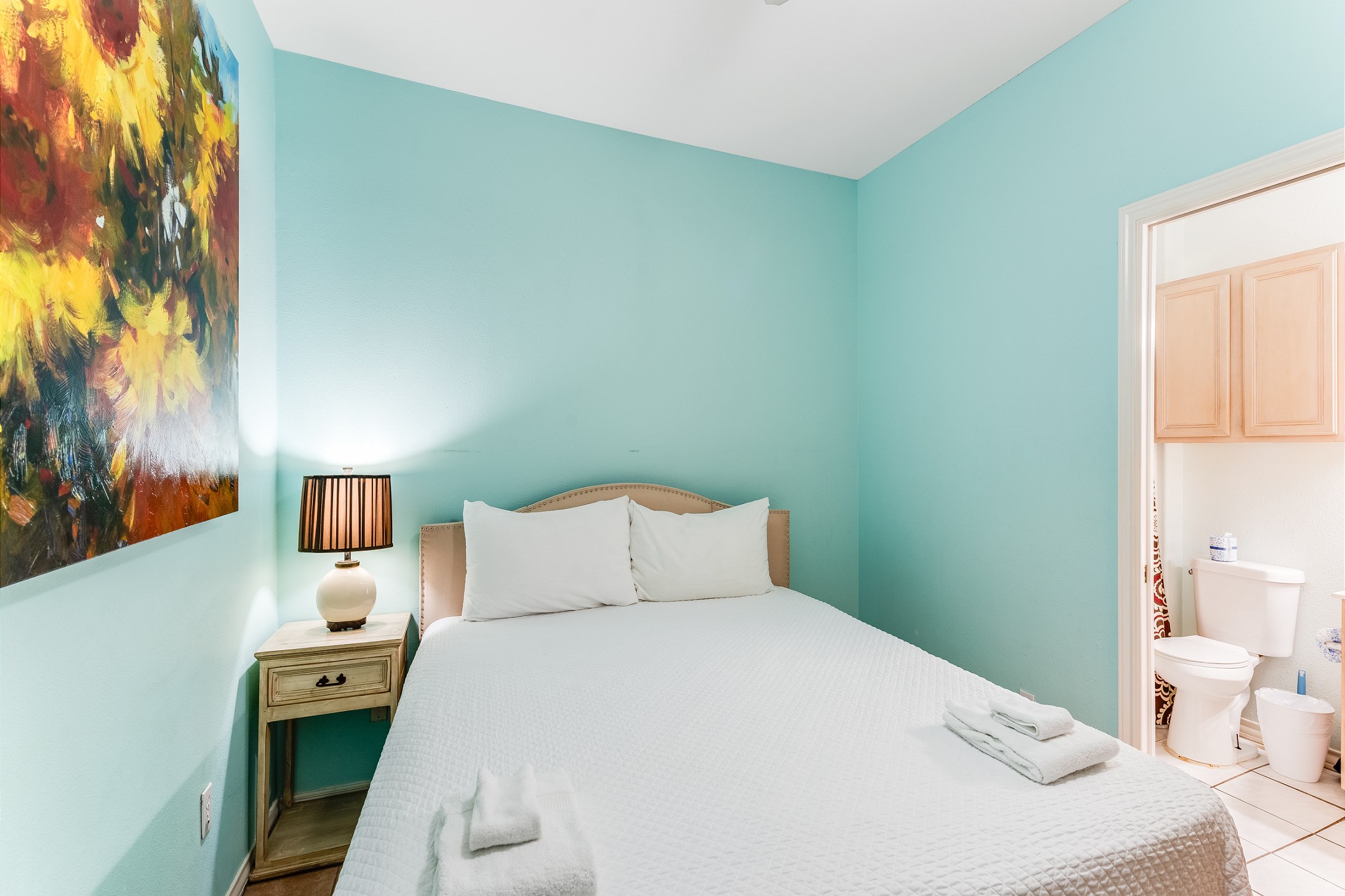 Second bedroom on the first floor with king size bed, private bathroom and flat screen TV