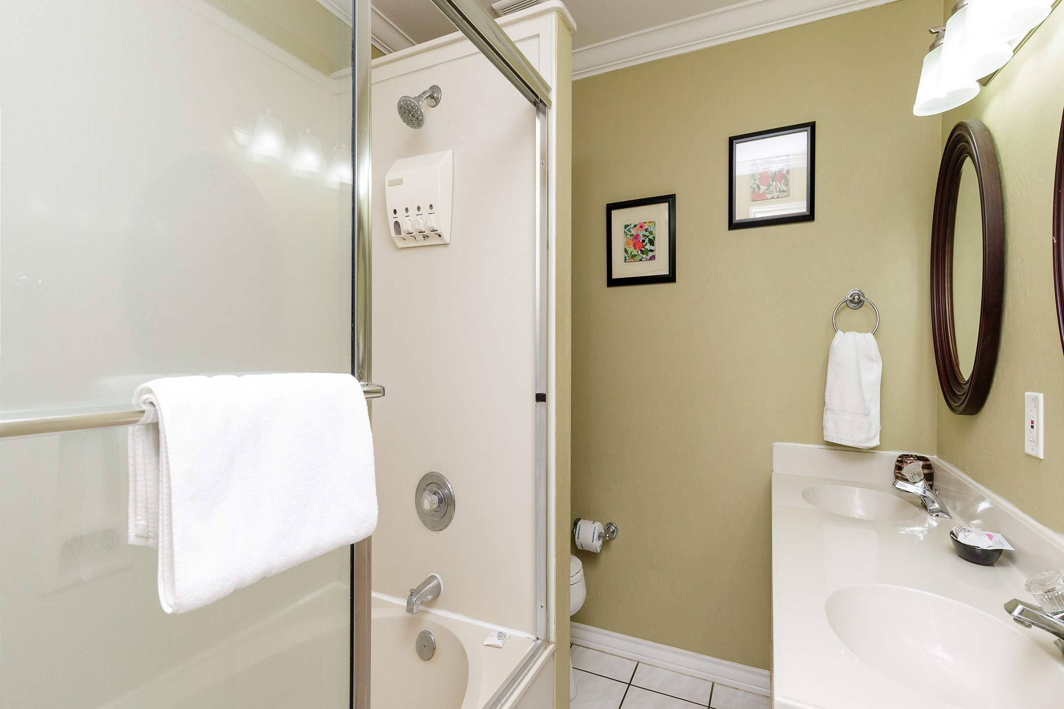 Master bathroom on the second floor with double sinks and tub/shower combo