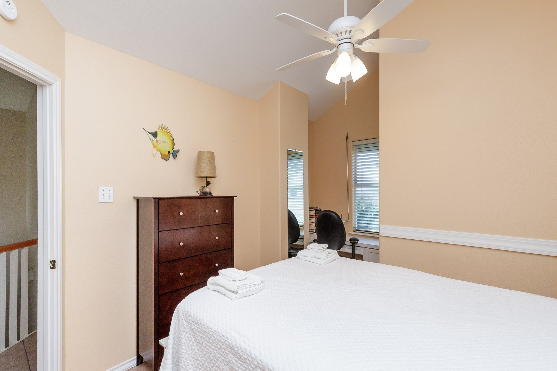 Third bedroom on the second floor with queen size bed and a workstation 