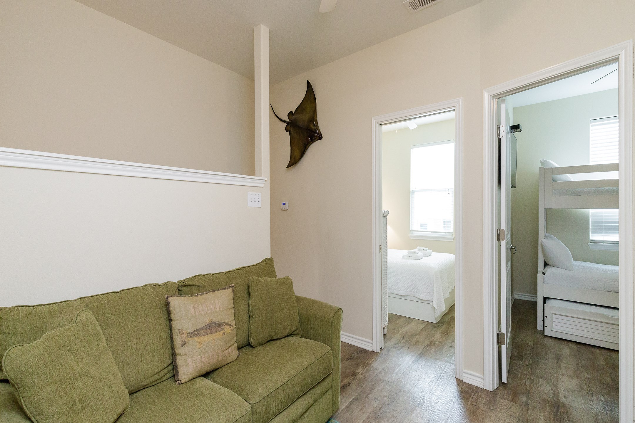 Inviting second floor loft area with a full-size sleeper sofa, perfect for additional guests, and includes a flat-screen TV for your entertainment needs