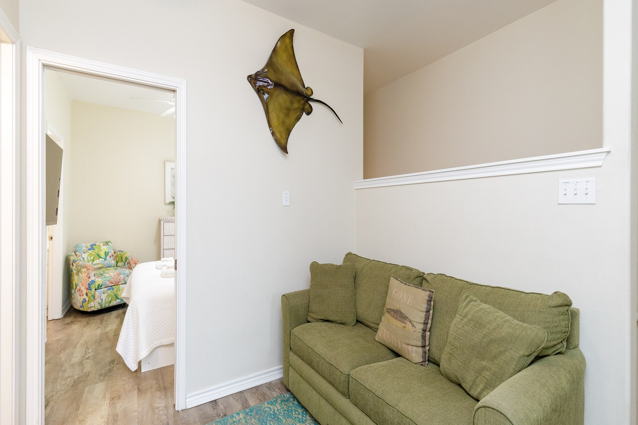 Inviting second floor loft area with a full-size sleeper sofa, perfect for additional guests, and includes a flat-screen TV for your entertainment needs