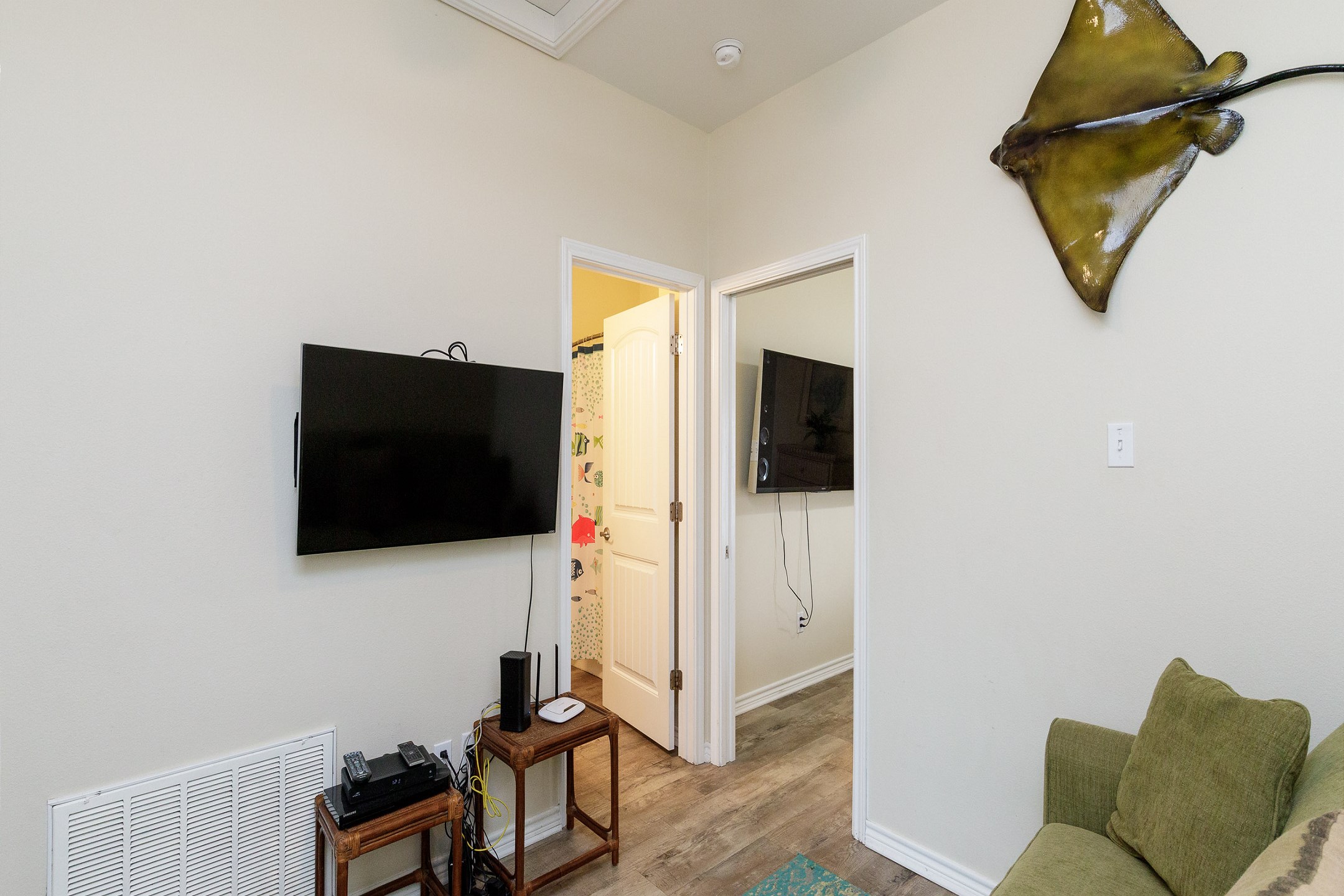 Inviting second floor loft area with a full-size sleeper sofa, perfect for additional guests, and includes a flat-screen TV for your entertainment needs