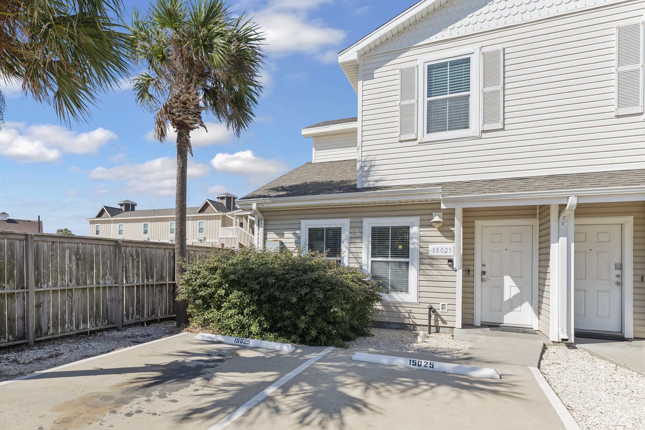 Front entrance to property with two reserved parking spots and coded lock for extra security
