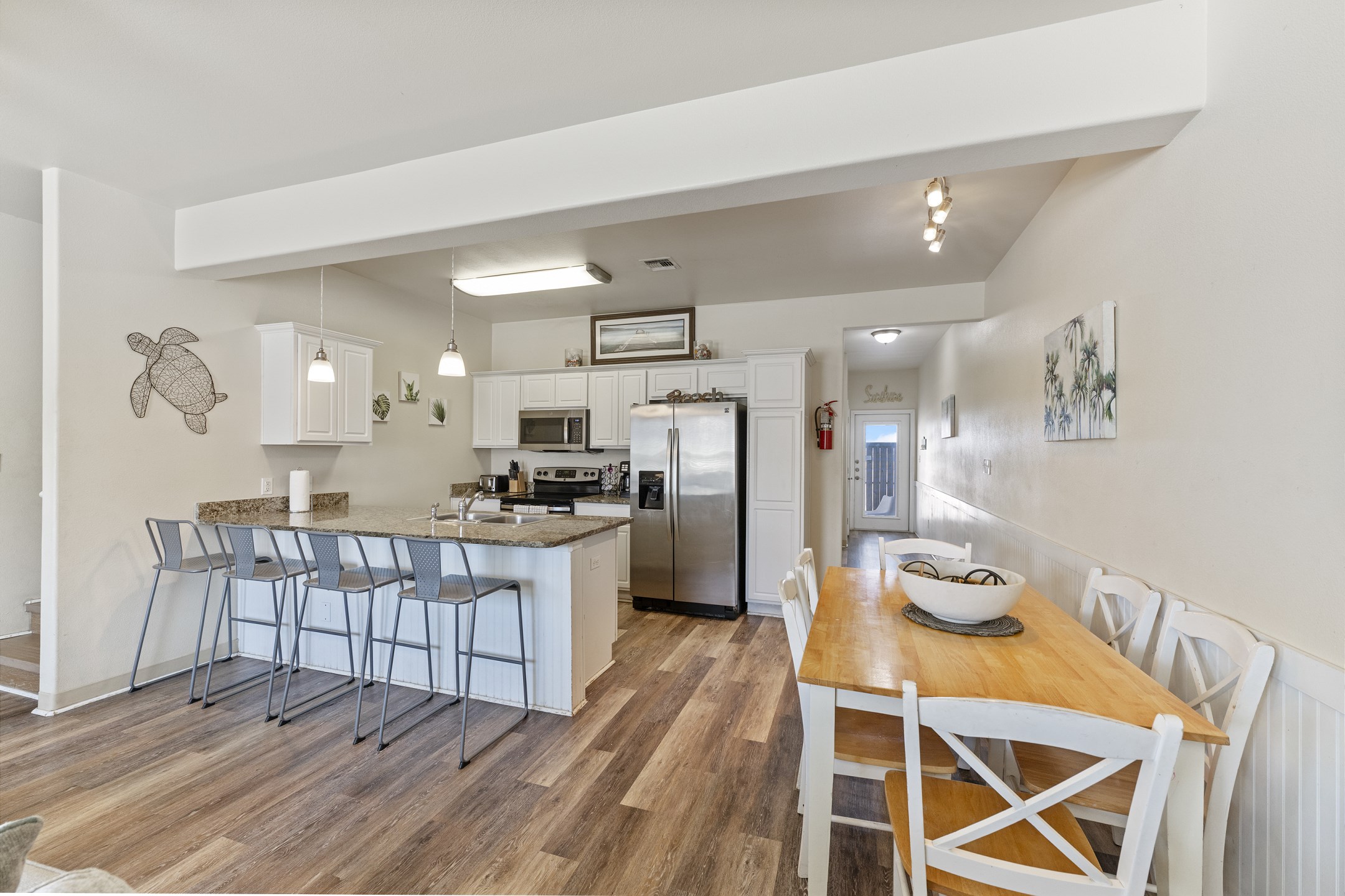 Guest-friendly dining and kitchen spaces designed for convenience and everyday cooking (K-cups not included)