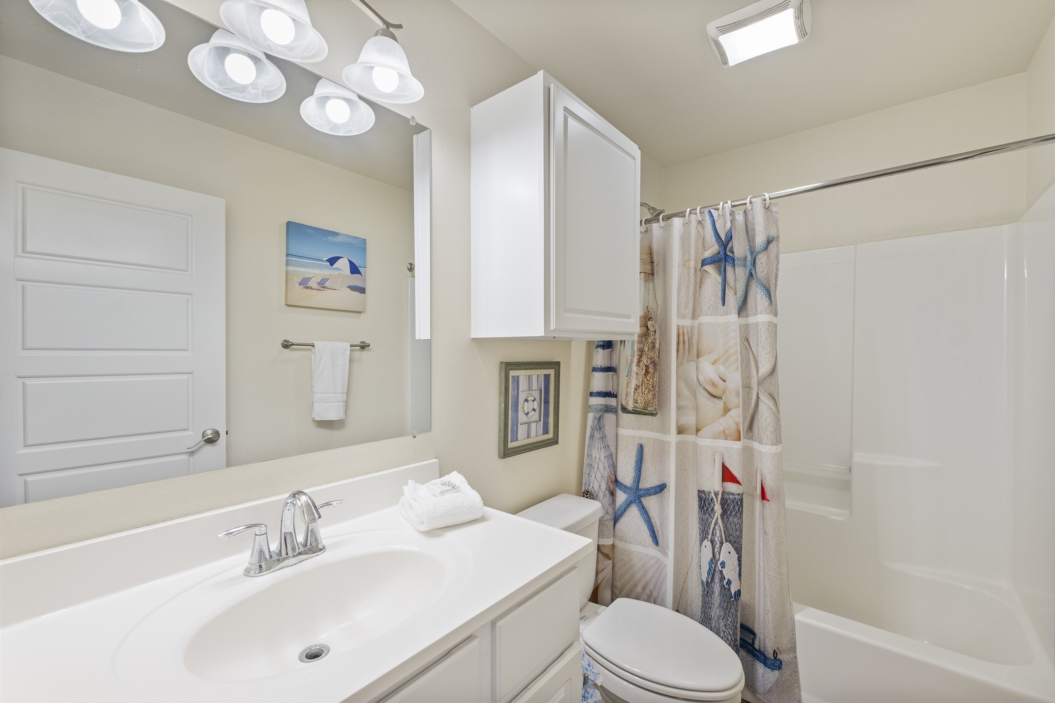 Guest bathroom on the first floor with tub/shower combo