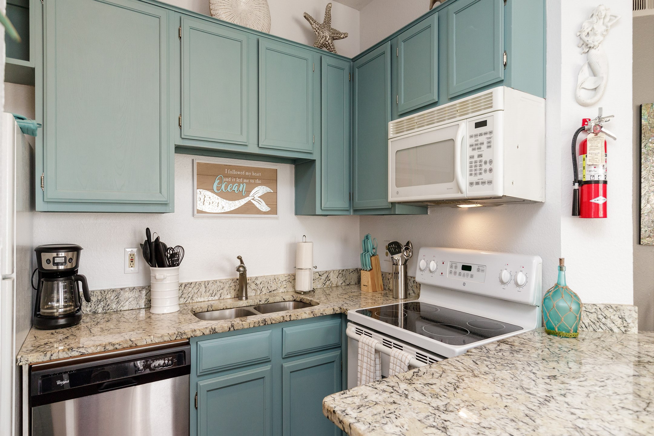 Beautiful kitchen area with updated cabinets and appliances 