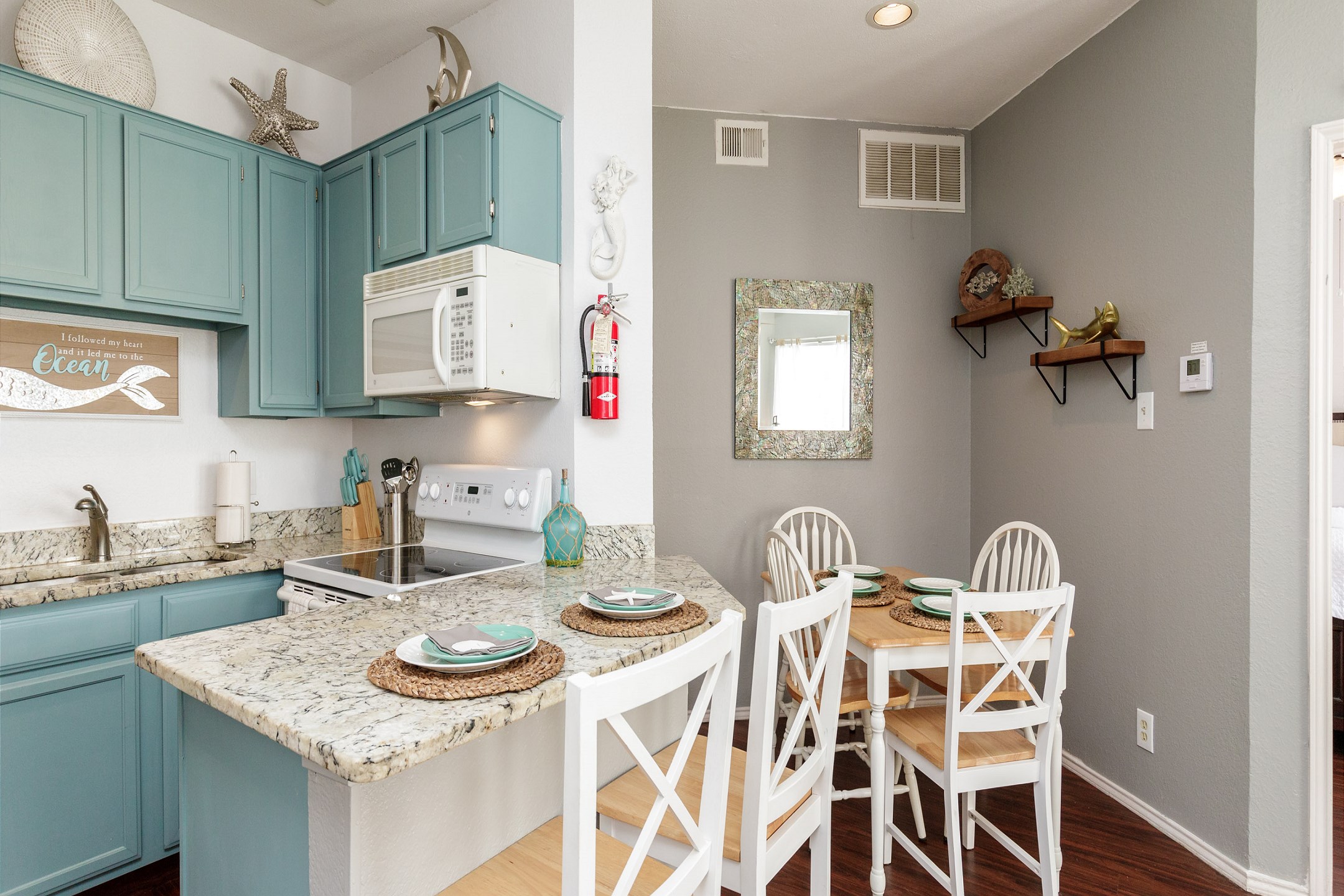 Kitchen area with breakfast bar that seats two