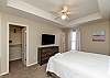 Second master suite on the third floor with king size bed, walk in closet and flat screen TV