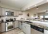 Fully equipped kitchen with beautiful counter tops and ample storage space