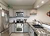 Fully equipped kitchen with stainless steel appliances and plenty of counter space 