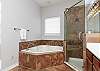 Master bathroom with double sinks, garden tub and walk in shower 