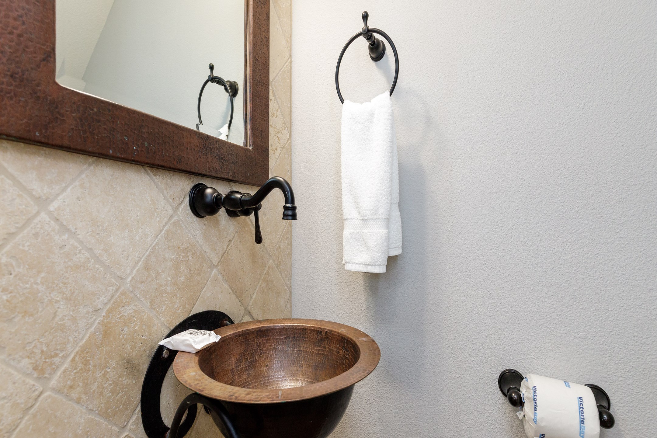 Half bathroom on the second floor off the kitchen area