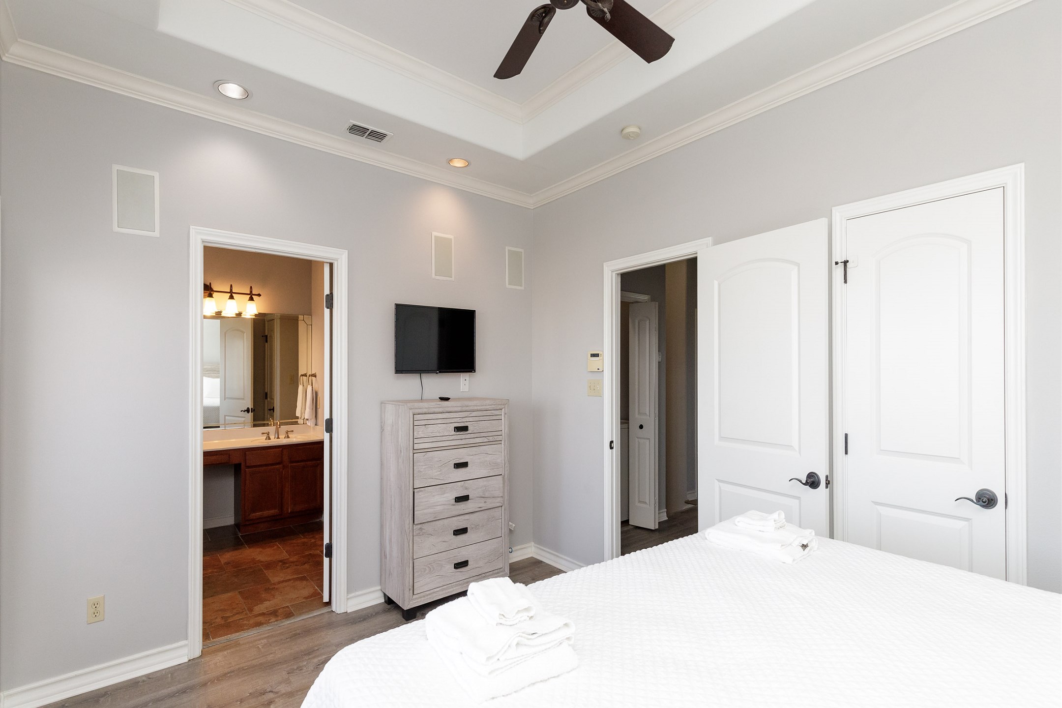 Master bedroom on the third floor with king size bed, private balcony, private bathroom and flat screen TV