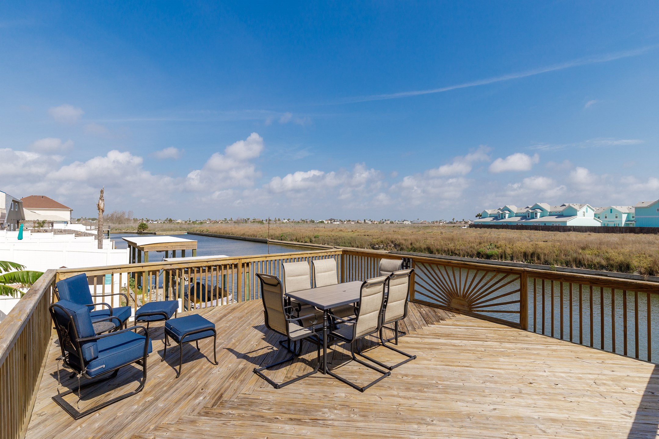 Sundeck with lounge chairs to enjoy the Texas breeze and beautiful canal views