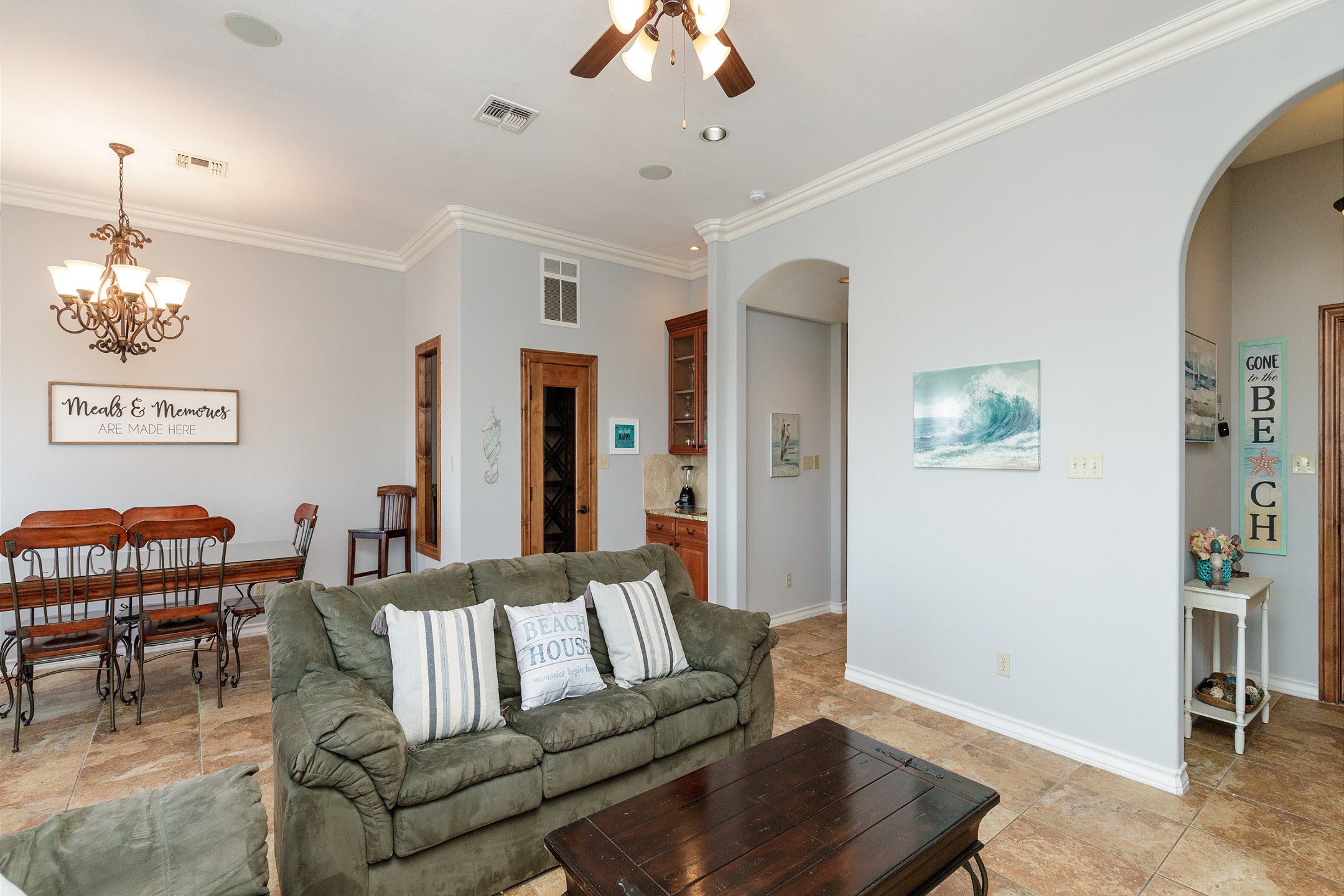 Open concept living and dining area with bright lighting - perfect spot to have family gatherings