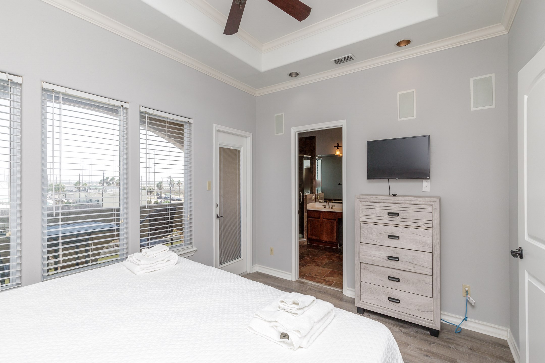 Master bedroom on the third floor with king size bed, private balcony, private bathroom and flat screen TV
