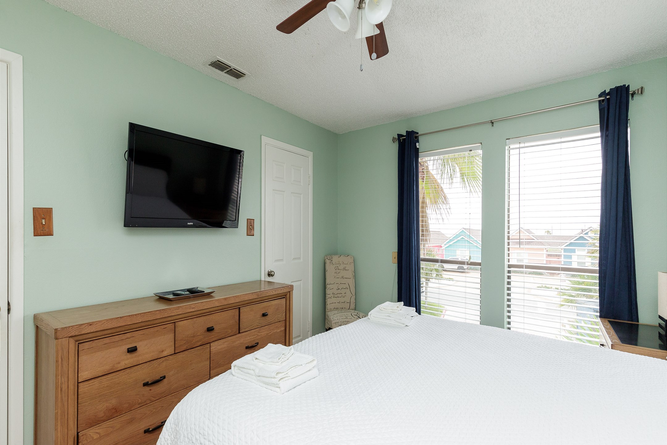 Master bedroom on the first floor with king size bed, private bathroom and flat screen TV