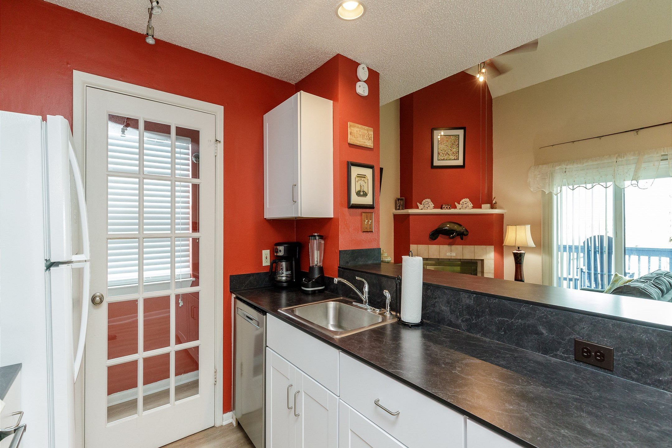 Great kitchen area with an open bar looking into the living space