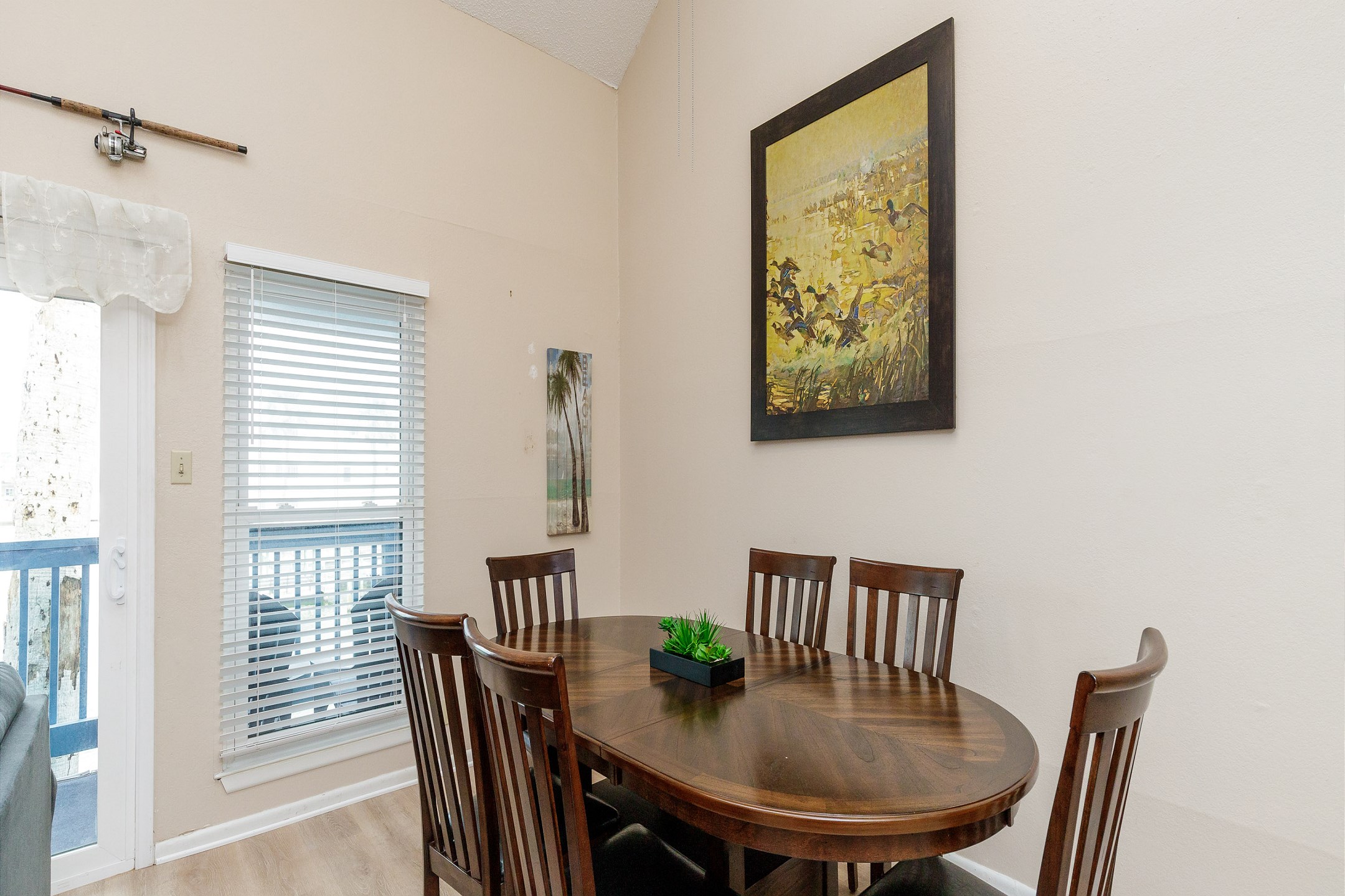 Dining table with seating for six for family gatherings while overlooking the canal waters