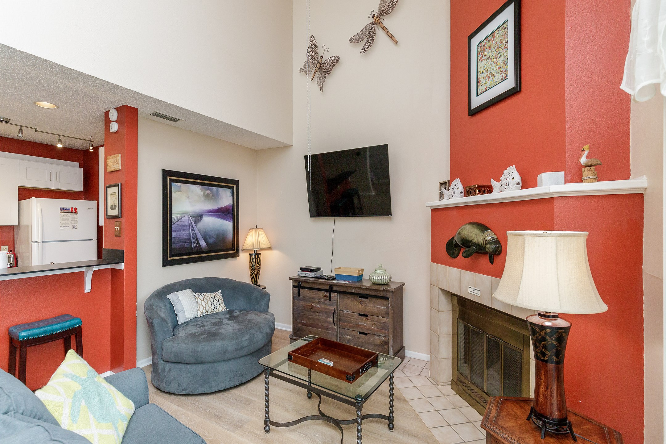 Open concept living area with flat screen TV and cozy furniture 