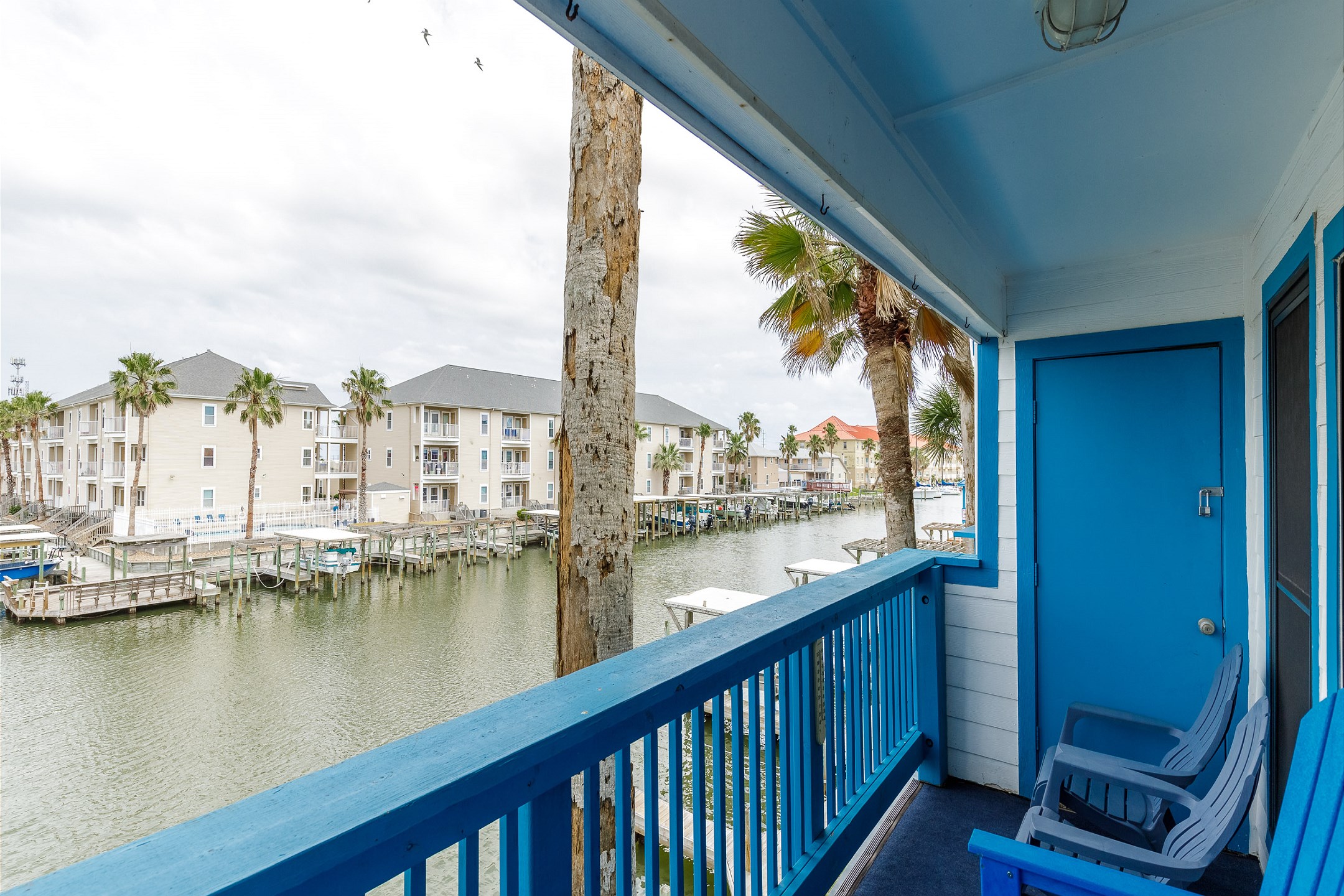 Private balcony off the living area offering calming views to unwind after a day at the beach