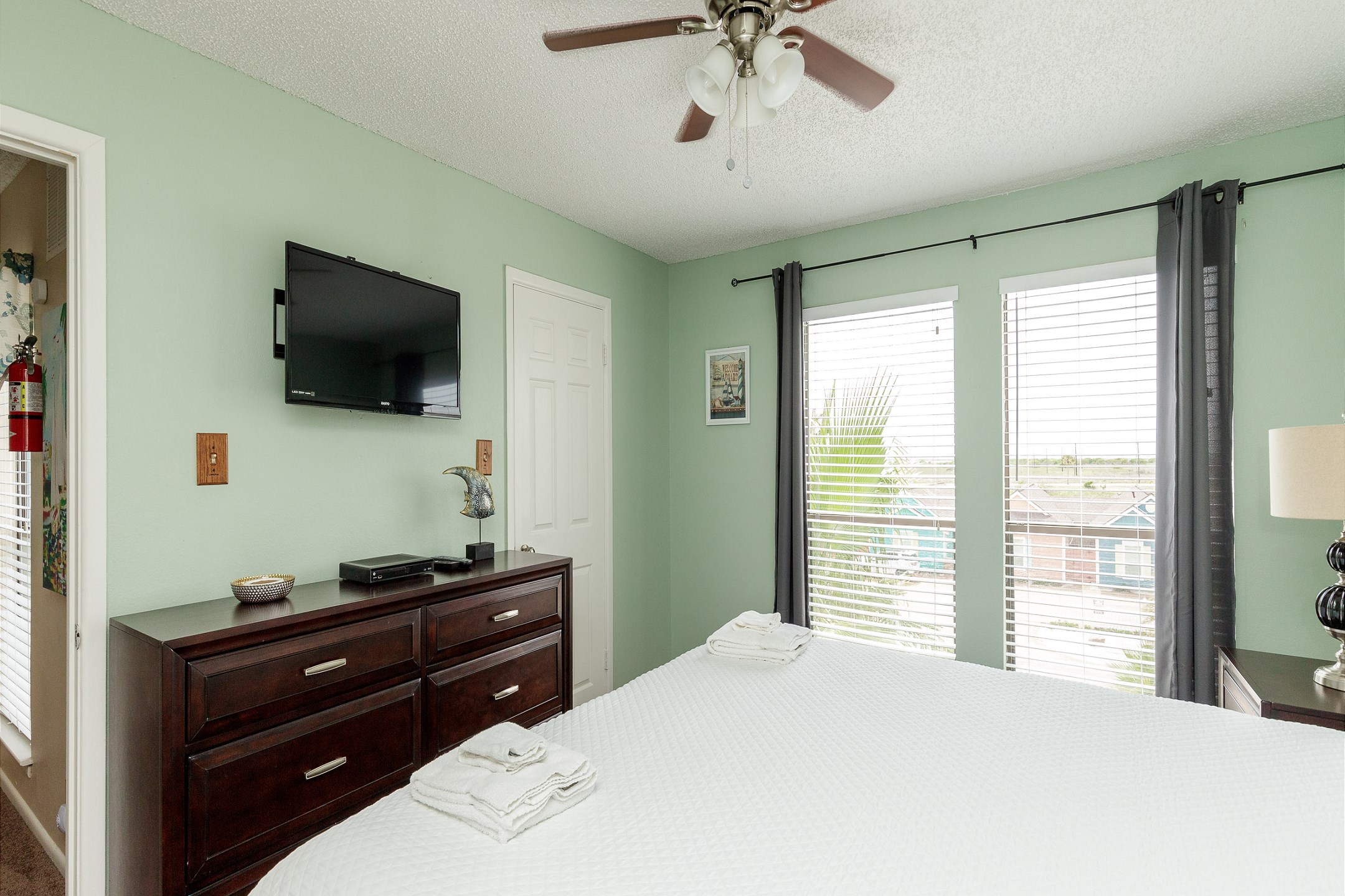 Second bedroom on the second floor with king size bed, private bathroom and flat screen TV