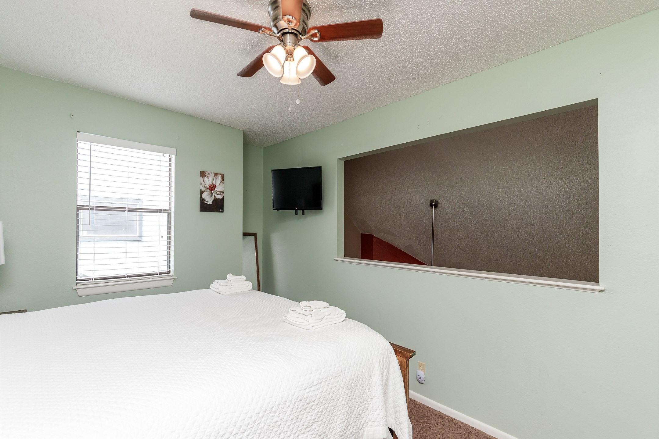 Third bedroom on the second floor with king size bed and flat screen TV