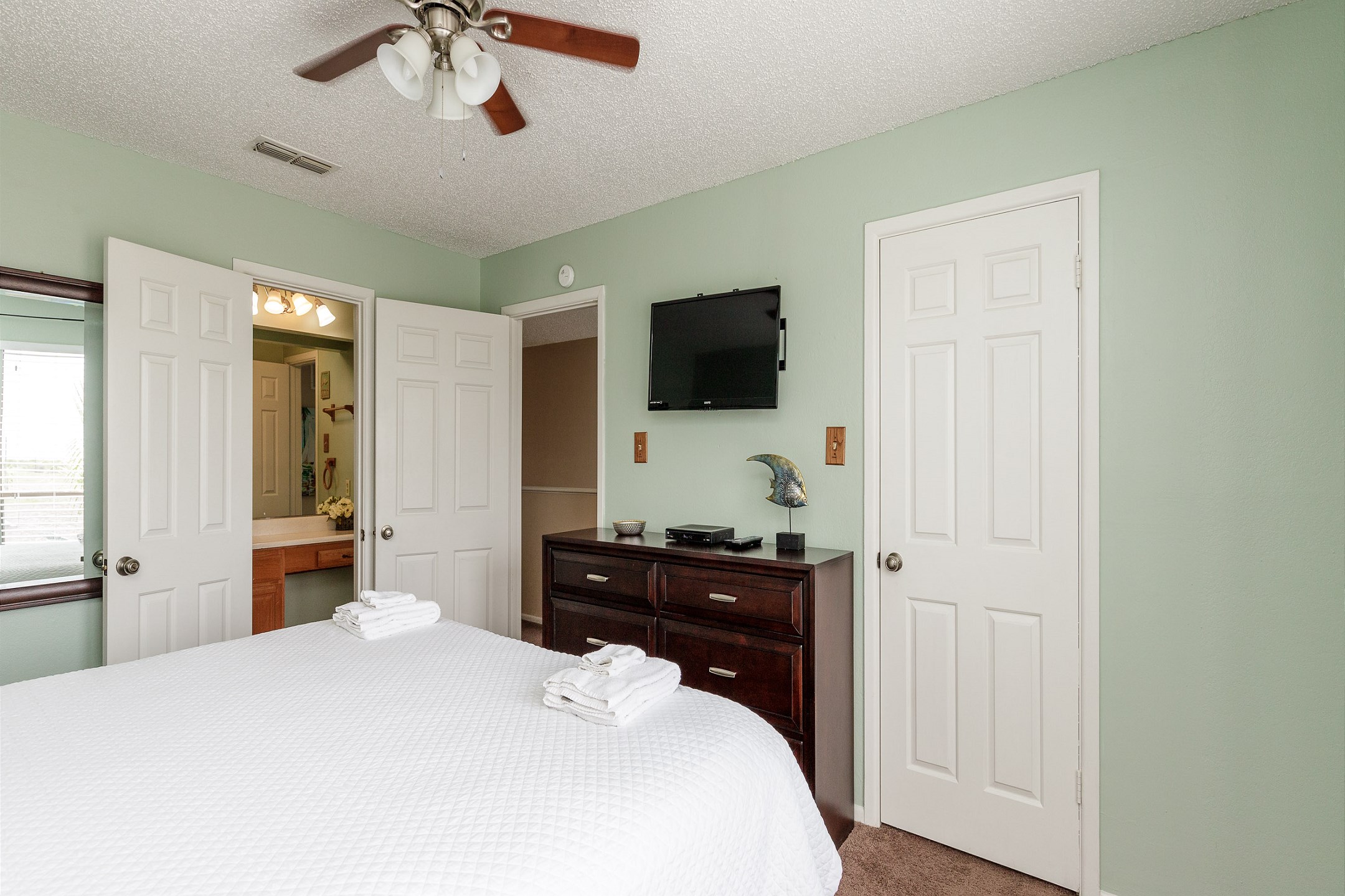 Second bedroom on the second floor with king size bed, private bathroom and flat screen TV