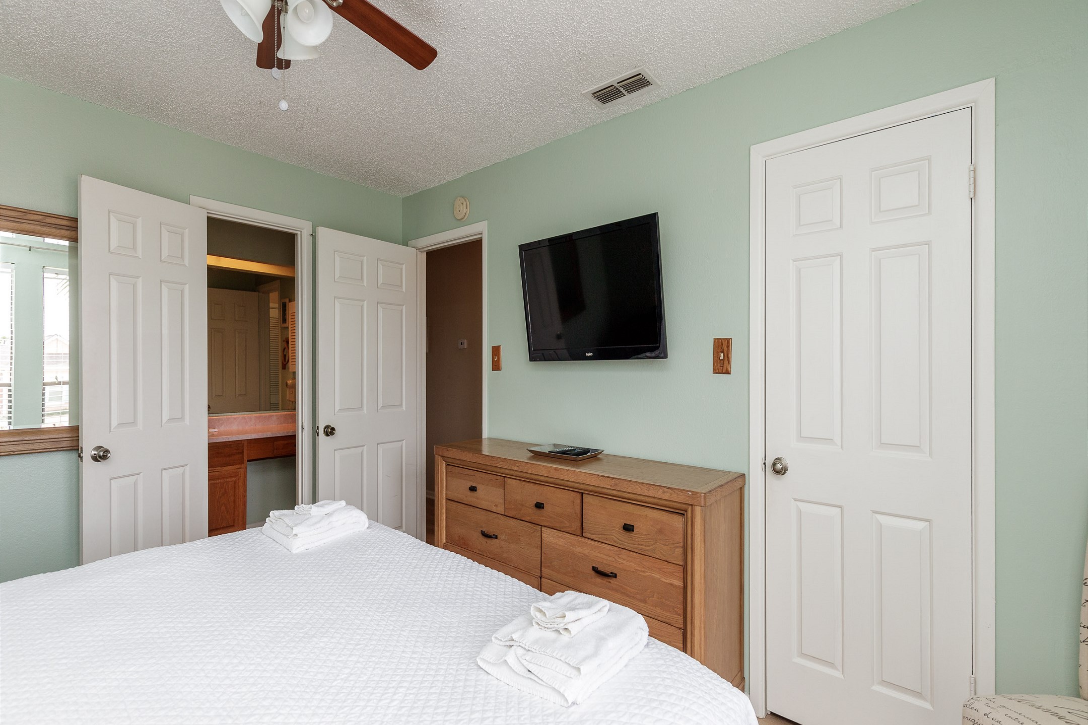 Master bedroom on the first floor with king size bed, private bathroom and flat screen TV