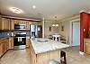 Fully equipped kitchen with ample storage and counter space to cook meals together 