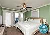 Master bedroom with king size bed and flat screen TV
