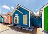 Colorful exterior cottage to book for your vacation