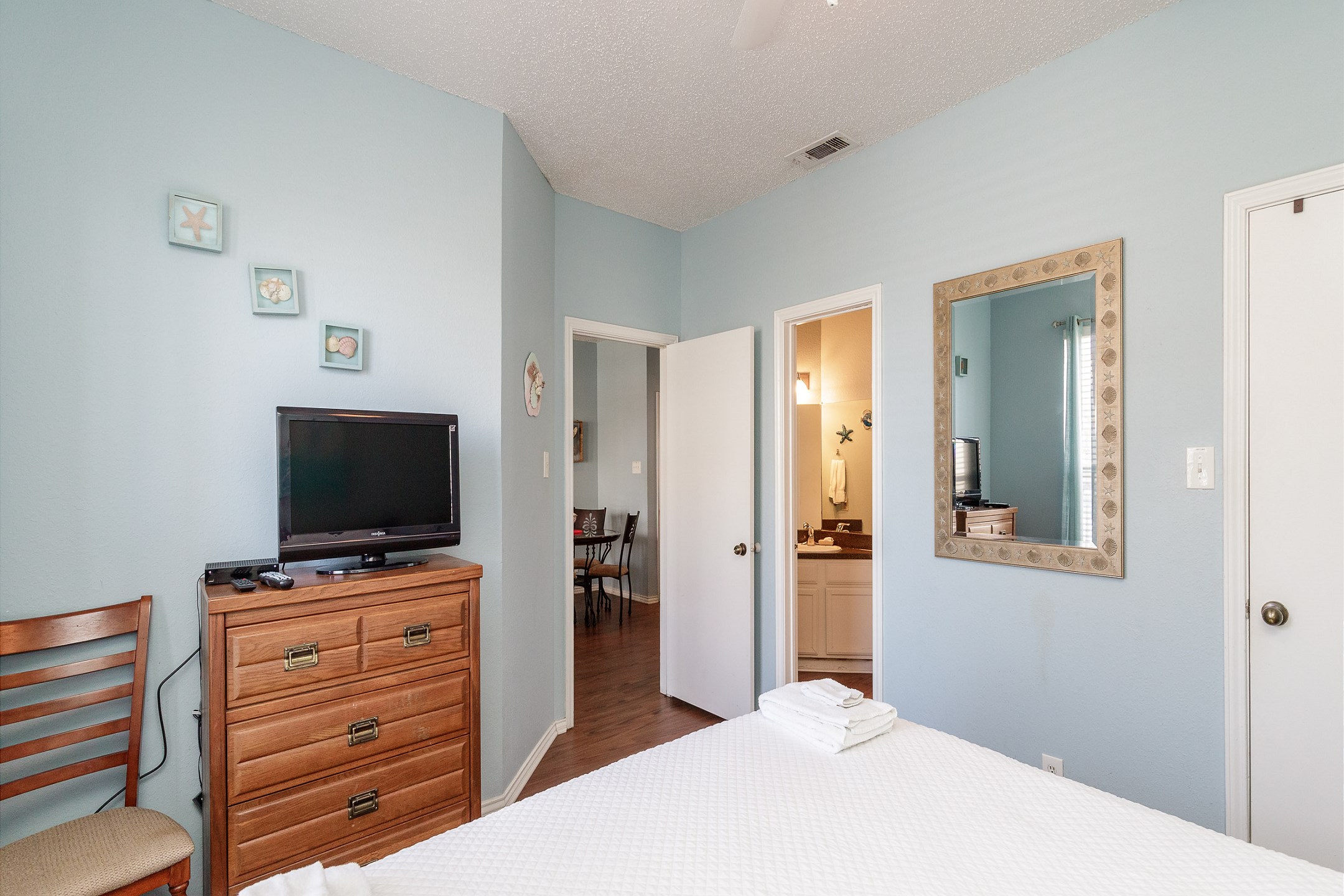 Master bedroom with king size bed and private bathroom