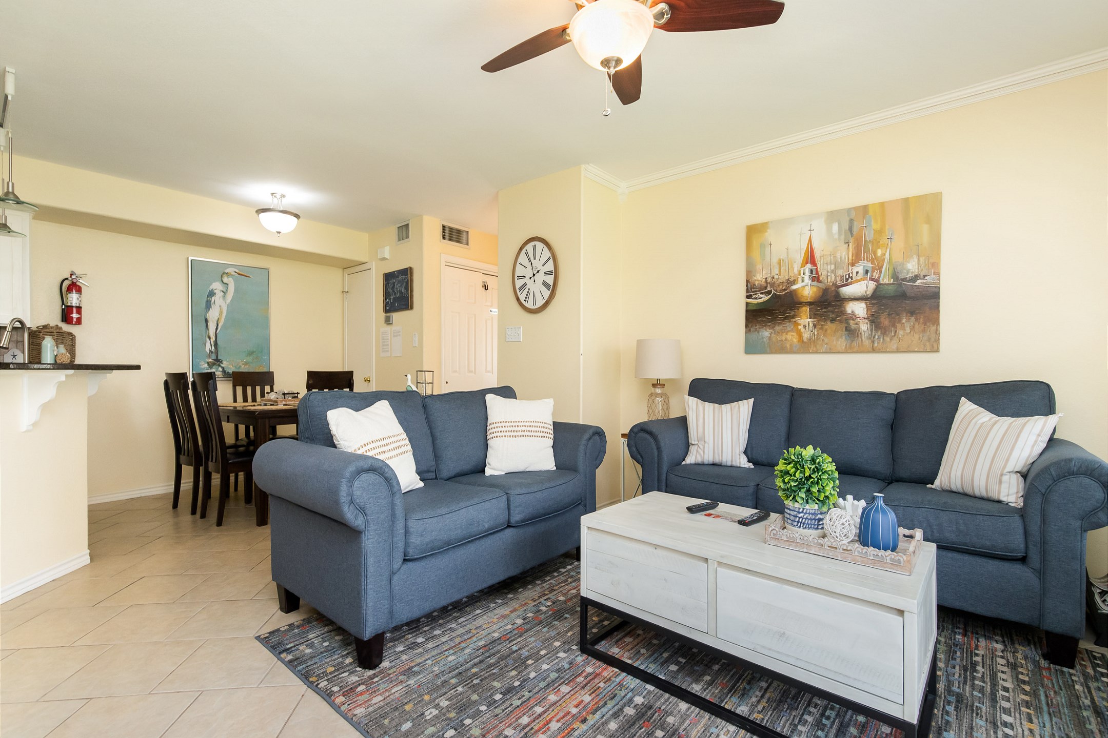 The kitchen, dining, and living areas blend together seamlessly for a bright and airy feel