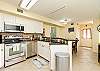 Fully equipped kitchen with stainless steel appliances and a beautiful back splash