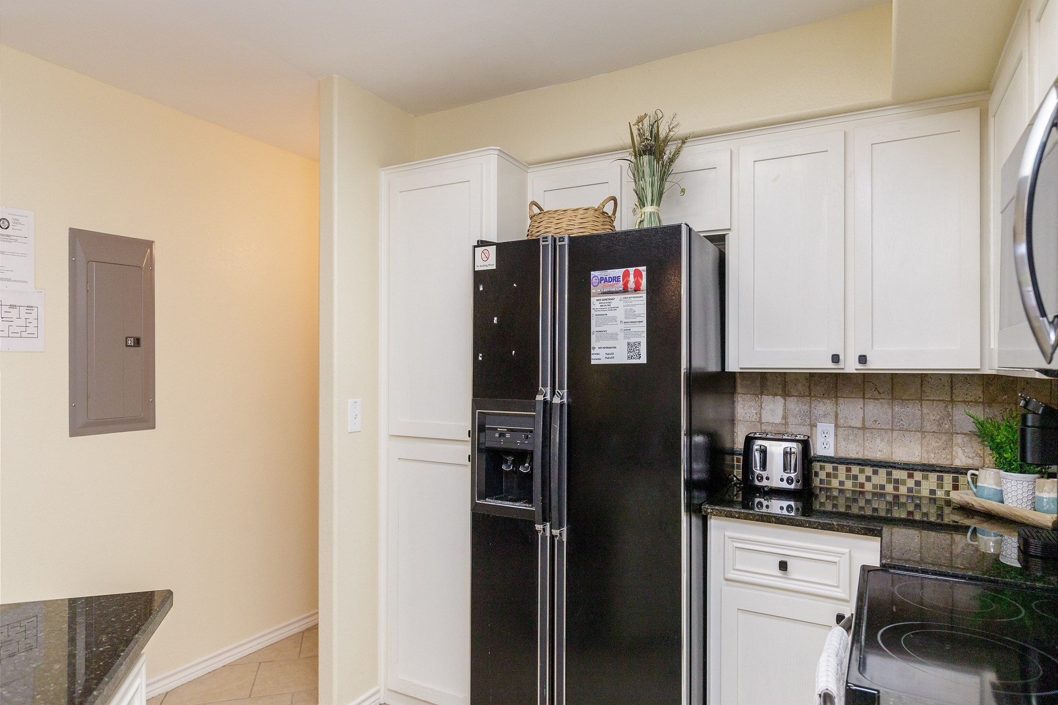 Great kitchen area with ample storage and counter space to cook meals together 