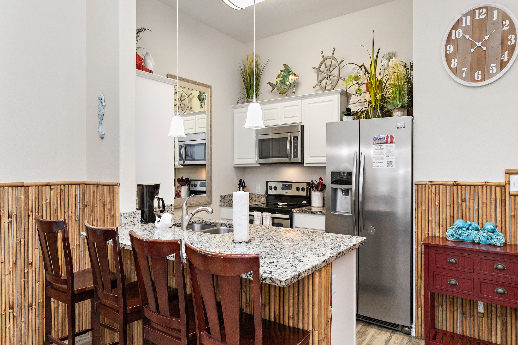 Fully equipped kitchen with breakfast bar that seats four 