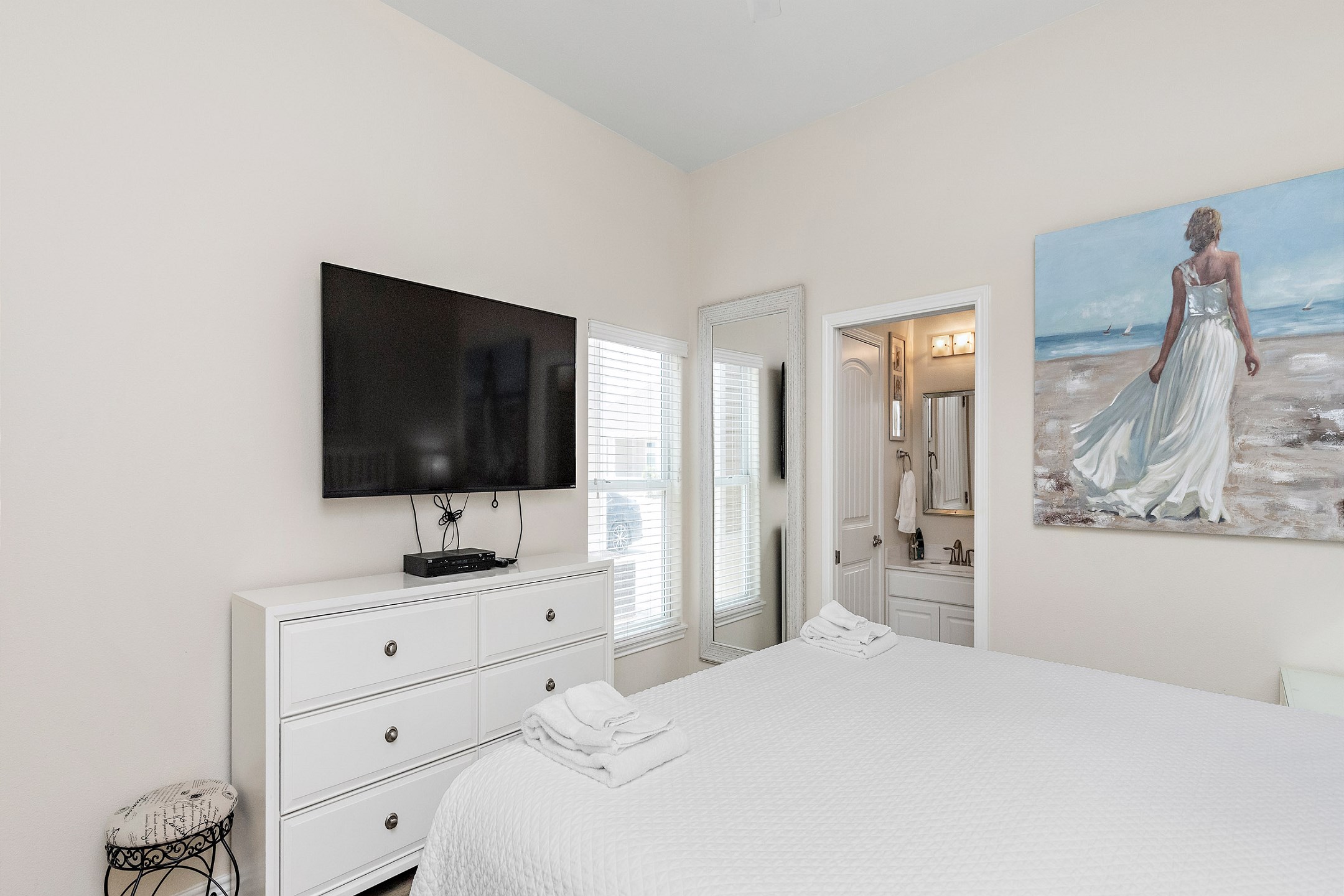 Master bedroom with king size bed, private bathroom and flat screen TV